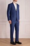 Corneliani Костюм мужской из шерсти голубой - Шлица, узор клетка. 100% шерсть. Пуговицы, крючок. Нагрудный карман, два кармана с клапанами. Карманы (внутренние): Три кармана. Два боковых кармана, два кармана сзади на пуговицах. 100% купро. Страна производитель: Италия. Уход: специализированная чистка - фото 3