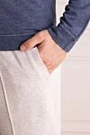 Brunello Cucinelli Light-colored cotton jersey trousers with cuffs at the hem
- 94% cotton, 6% polyamide. Closure: Drawstring. Two side pockets, two back pockets. Country of origin: Italy. Care: specialized cleaning - photo 5