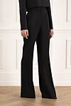 Balmain Женские шерстяные классические брюки клёш чёрные - расклешенный крой. два боковых кармана. шерсть. пуговица, молния. Страна производитель: Франция. Уход: специализированная чистка - фото 3