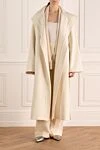 White cashmere coat for women Loro Piana - side cuts. 100% cashmere. Fastener: belt. two pockets. Country of manufacture: Italy. Care: specialized cleaning - photo 2