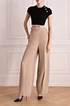 Топ женский черный Balmain - 3 декоративные металлические пуговицы «Signature Lion» золотого цвета.. 39% хлопок, 39% модал, 12% эластан, 10% полиамид. Страна производитель: Франция. Уход: специализированная чистка - фото 2