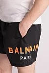 Balmain Шорты пляжные из полиэстера мужские черные - доготип бренда. 100% полиэстер. кулиска. два передних кармана. Страна производитель: Франция. Уход: специализированная чистка - фото 5