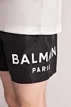 Balmain Men's black polyester shorts - brand logo. 100% polyester. Closure: drawstring. two side pockets. Country of manufacture: Italy. Care: specialized cleaning - photo 5