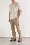Men's beige tapered cargo pants C.P. Company - Decoration: C.P. Company lens. 98% cotton, 2% polyamide. zipper, button. two side pockets, two back pockets, two leg pockets. Country of origin: Italy. Care: Specialized cleaning - photo 2