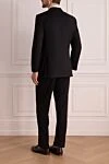 Костюм мужской из шерсти черный Canali - Шлица. 100% шерсть. Пуговицы, крючок. Нагрудный карман, два кармана с клапанами. Карманы (внутренние): Три кармана. Два боковых кармана, два кармана сзади на пуговицах. 100% купро. Страна производитель: Италия. Уход: специализированная чистка - фото 4