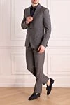 Костюм мужской из шерсти и шелка серый Brioni - Узор полоска, шлица. 85% шерсть, 15% шёлк. Пуговицы, крючок. Нагрудный карман, два кармана с клапанами. Карманы (внутренние): Три кармана. Два боковых кармана, два кармана сзади на пуговицах. 100% купро. Страна производитель: Италия. Уход: специализированная чистка - фото 2
