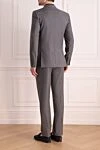 Костюм мужской из шерсти и шелка серый Brioni - Узор полоска, шлица. 85% шерсть, 15% шёлк. Пуговицы, крючок. Нагрудный карман, два кармана с клапанами. Карманы (внутренние): Три кармана. Два боковых кармана, два кармана сзади на пуговицах. 100% купро. Страна производитель: Италия. Уход: специализированная чистка - фото 4
